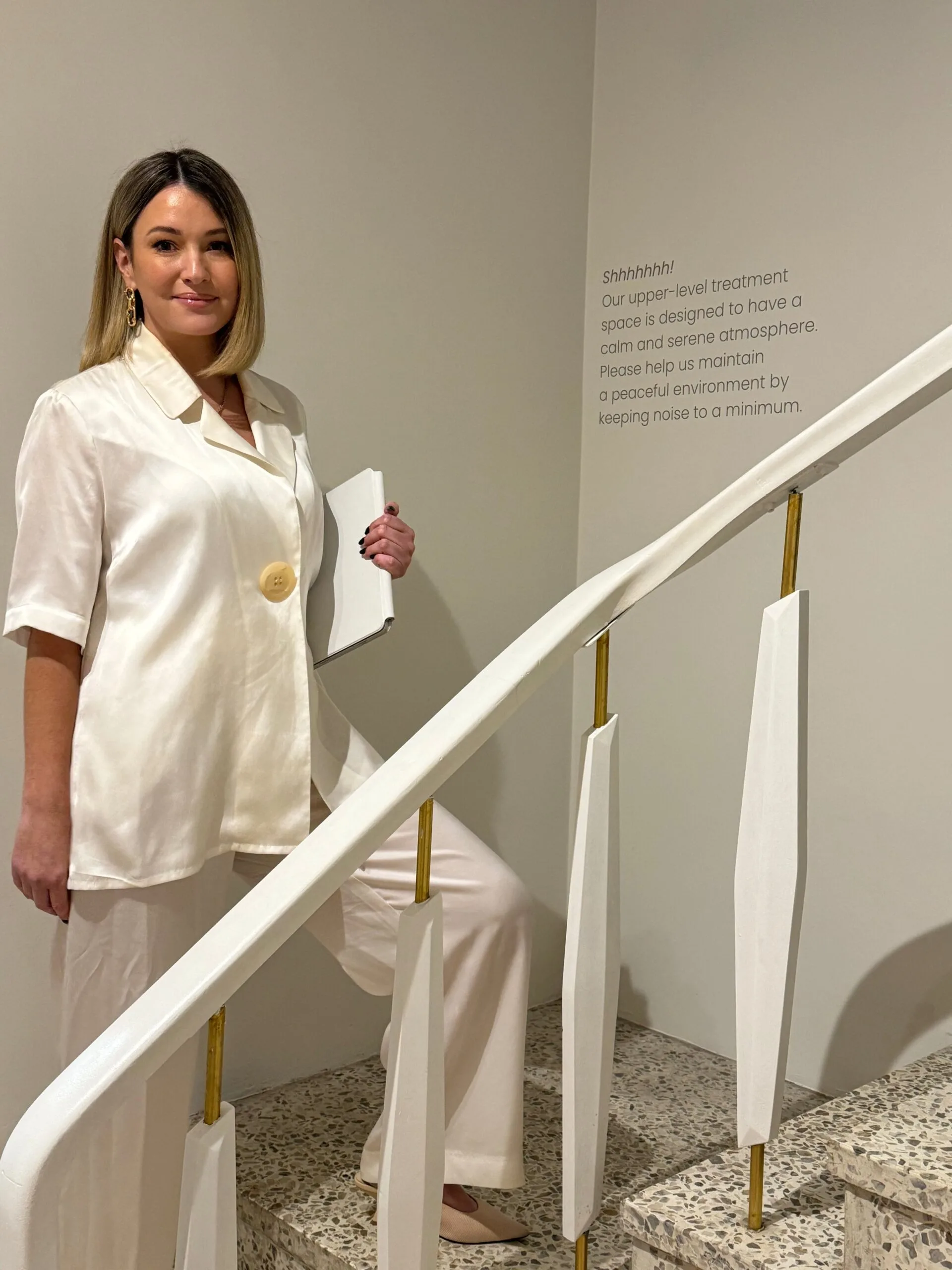 Plump clinician with a client in a treatment room at the South Yarra clinic