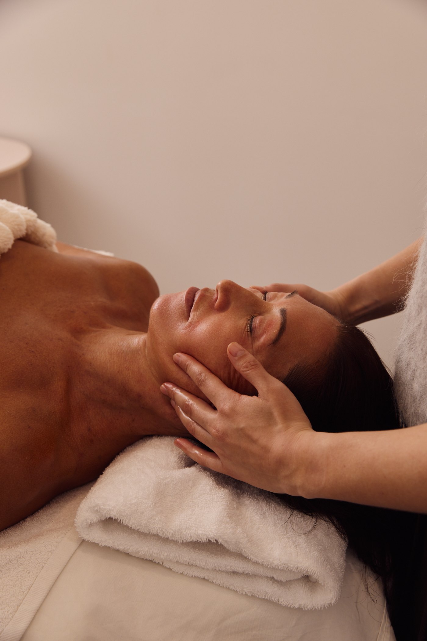 Therapist releasing jaw and facial tension during a TMJ remedial face release at Plump Aesthetic Clinic in South Yarra
